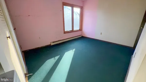 a view of an empty room and window