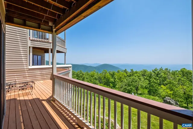 a view of a balcony with wooden floor