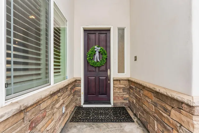 an empty room with wooden floor and a window