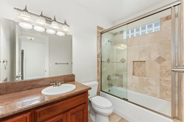 a bathroom with a shower and toilet