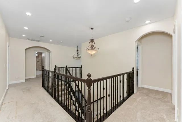 an empty room with a empty space and a ceiling fan