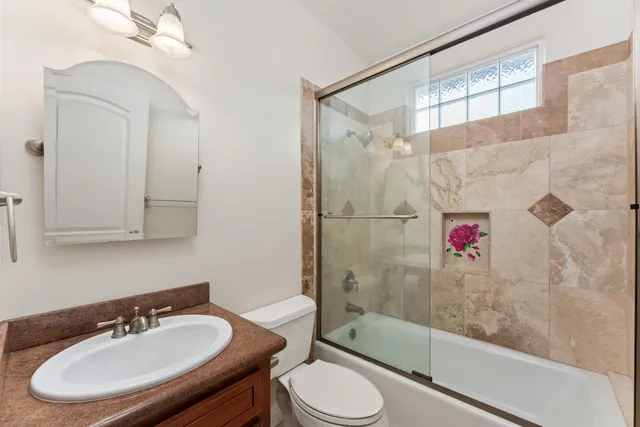 a front view of a house with trees