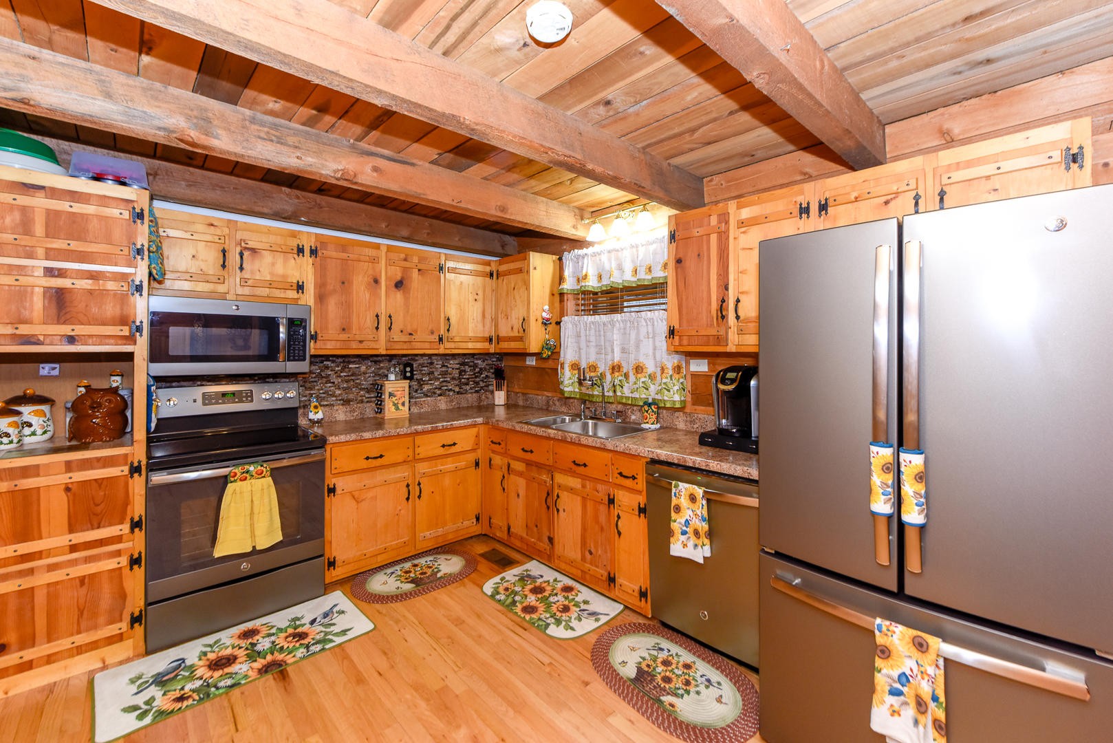 4433 Morganton Road Maryville, TN 37801 - Photo 15 of 40 a kitchen with stainless steel appliances granite countertop a refrigerator a stove and a sink with wooden floor