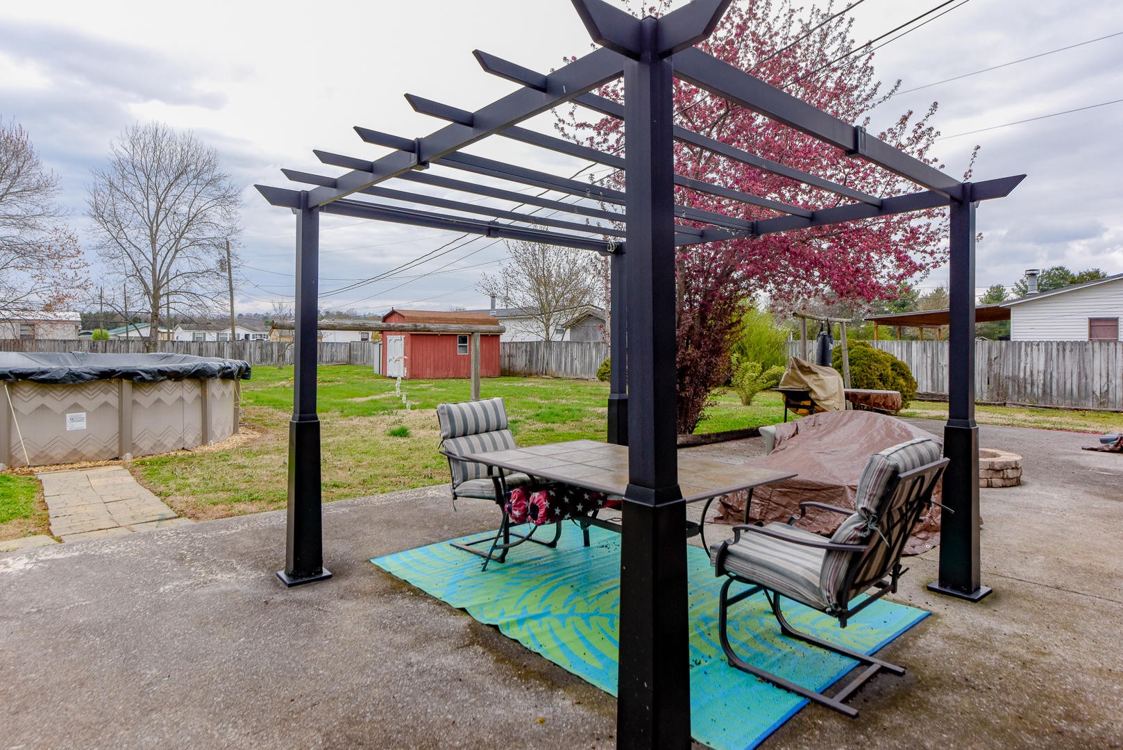 4433 Morganton Road Maryville, TN 37801 - Photo 35 of 40 a view of a patio with a table chairs and a backyard