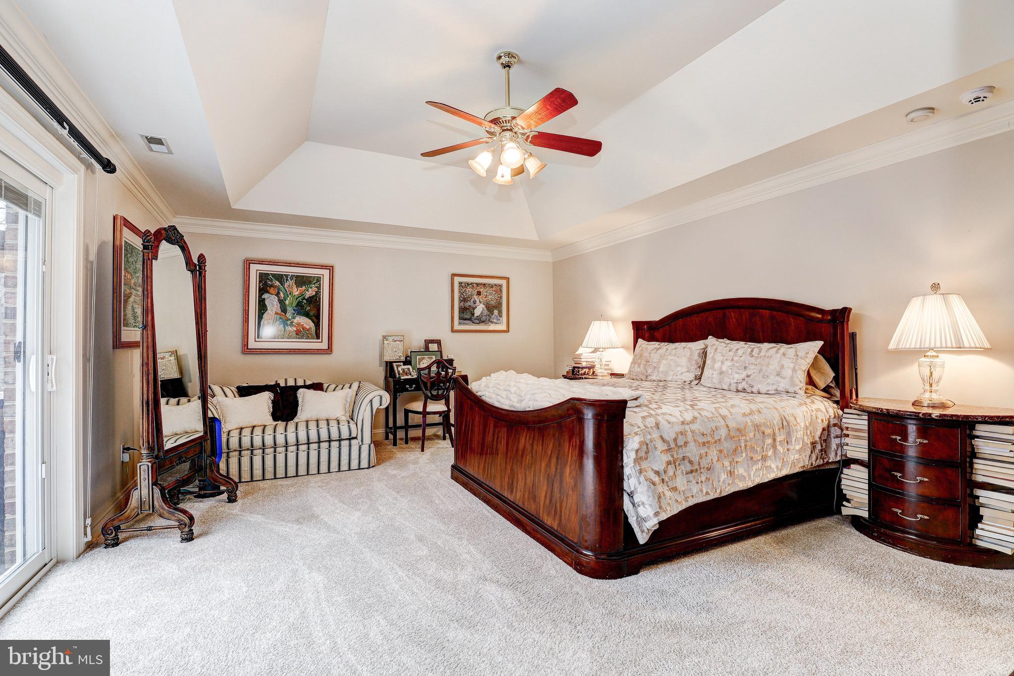 17420 Wesley Chapel Road Monkton, MD 21111 - Photo 26 of 76 a bedroom with a bed and a chandelier