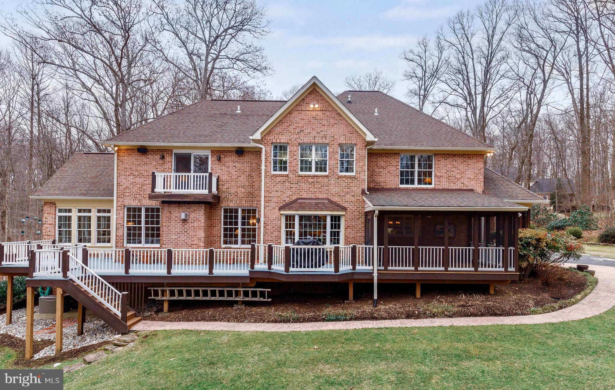 17420 Wesley Chapel Road Monkton, MD 21111 - Photo 3 of 76 a front view of a house with a garden and trees