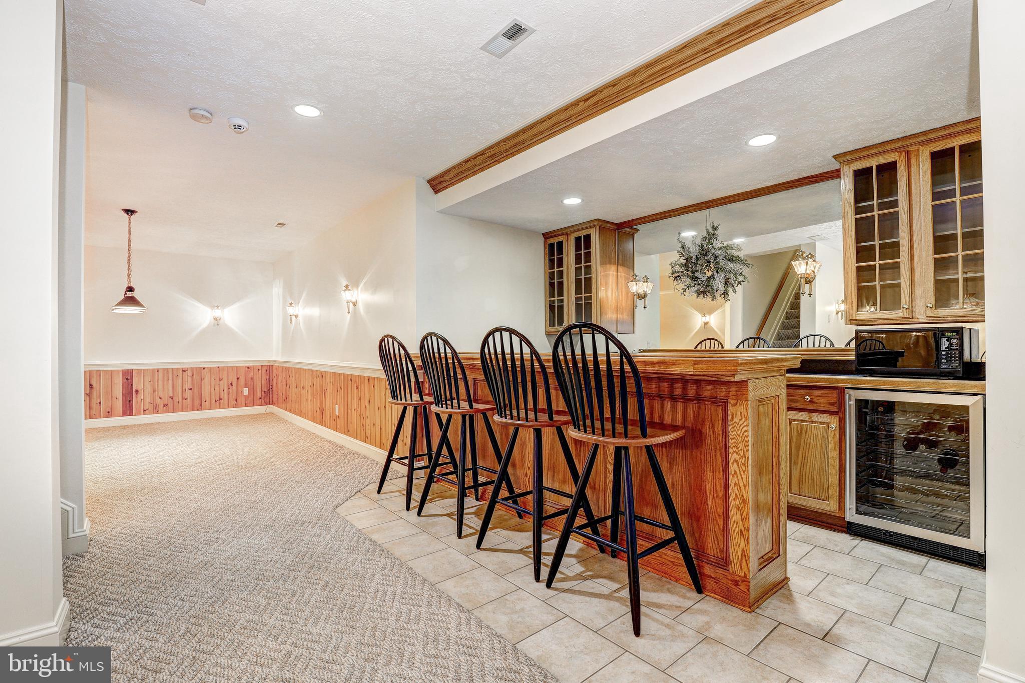 17420 Wesley Chapel Road Monkton, MD 21111 - Photo 42 of 76 a dining room with furniture and a floor to ceiling window