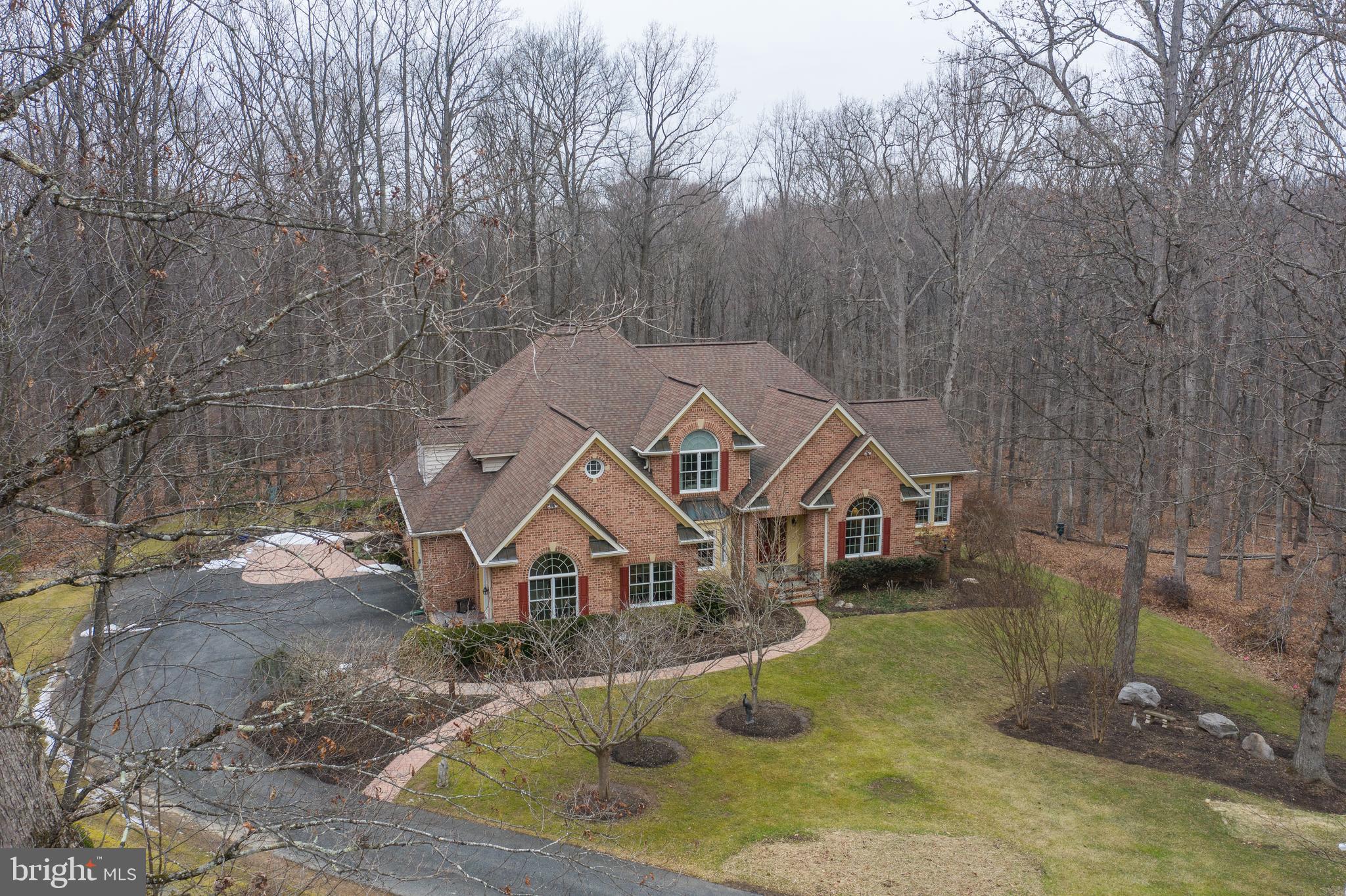 17420 Wesley Chapel Road Monkton, MD 21111 - Photo 59 of 76 a aerial view of a house next to a yard with large trees