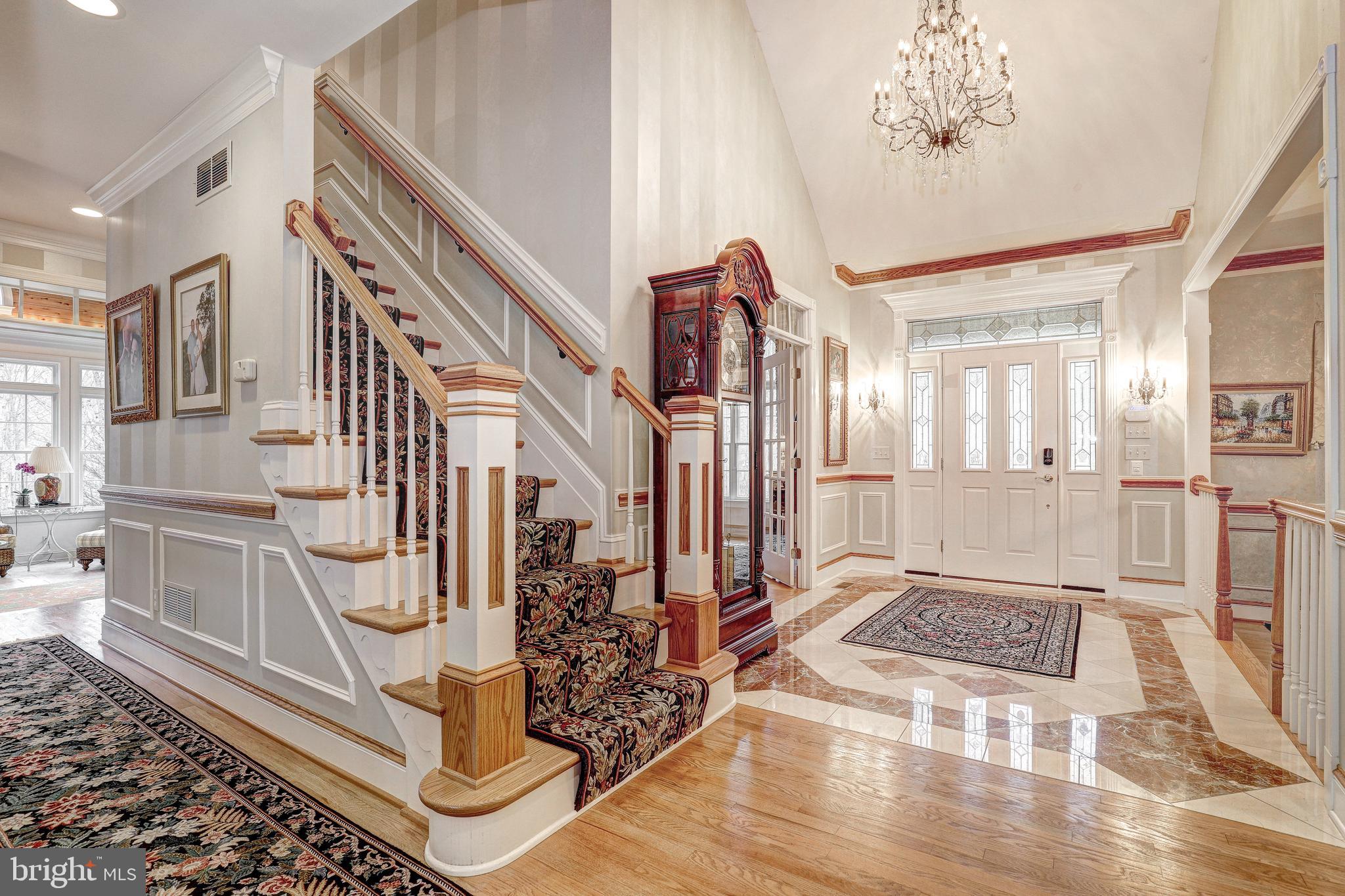 17420 Wesley Chapel Road Monkton, MD 21111 - Photo 6 of 76 a view of an entryway with wooden floor and a rug