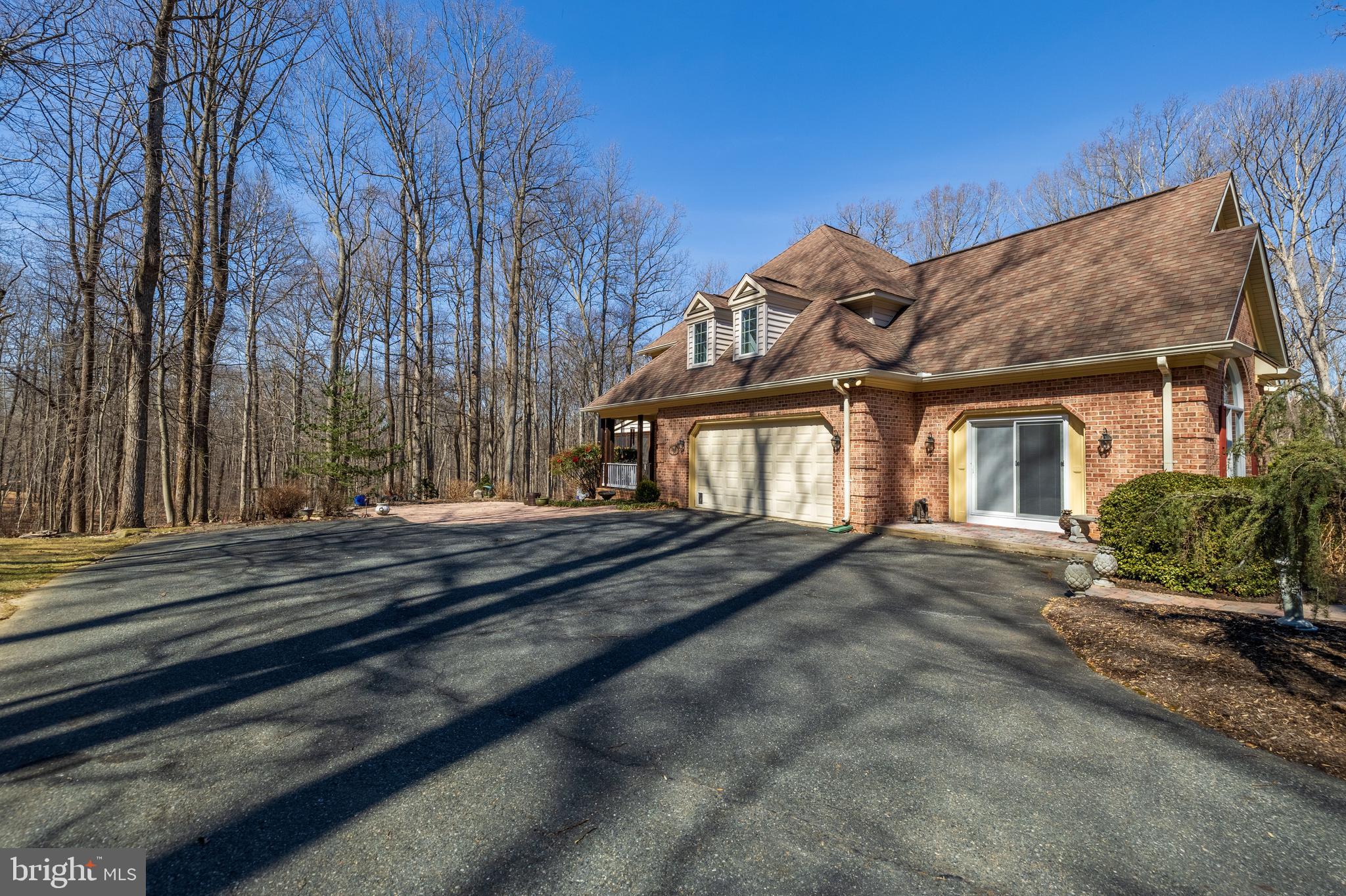17420 Wesley Chapel Road Monkton, MD 21111 - Photo 62 of 76 a view of a house with a bed and wooden fence
