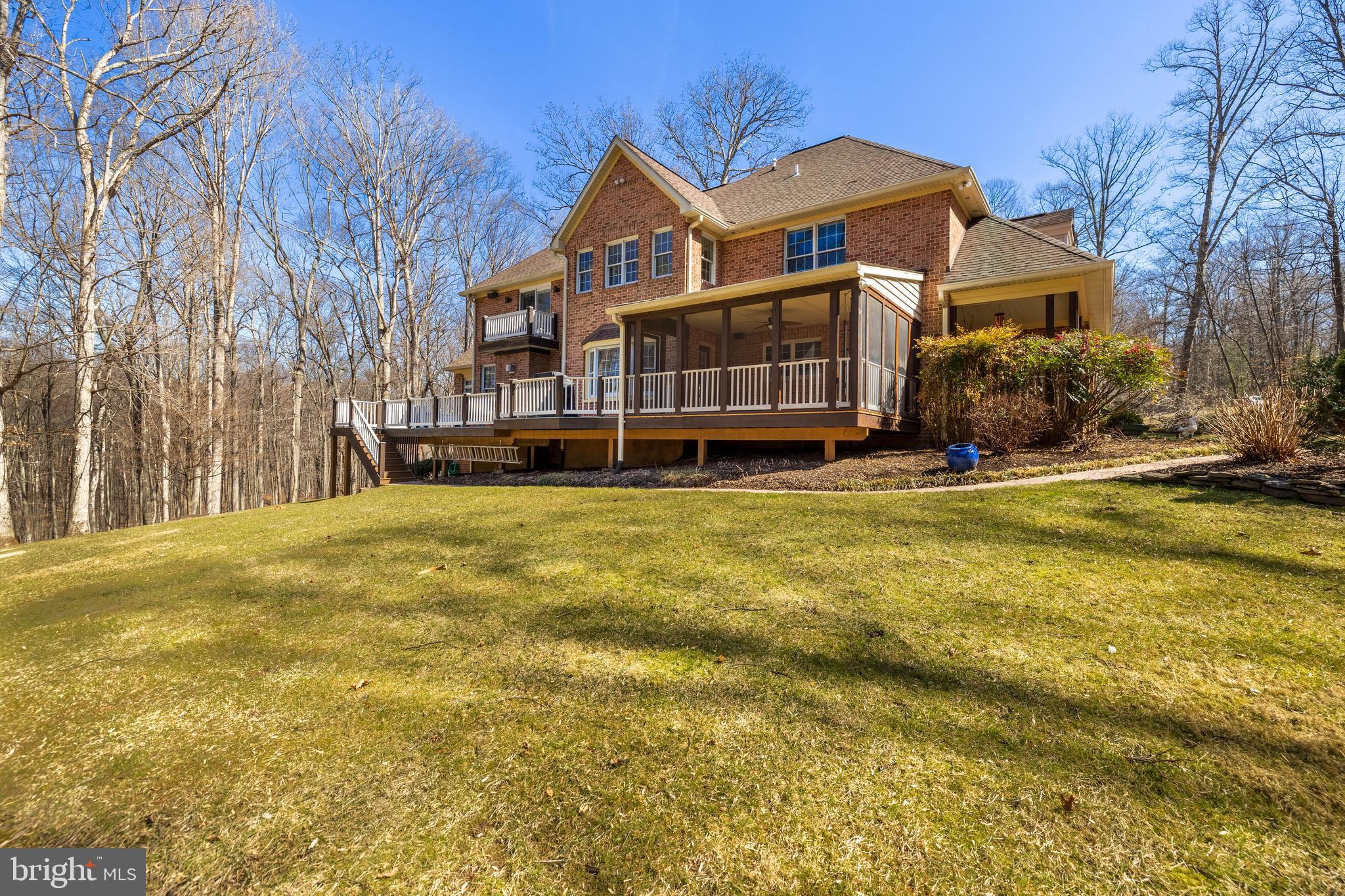 17420 Wesley Chapel Road Monkton, MD 21111 - Photo 66 of 76 a front view of a house with a yard table and chairs