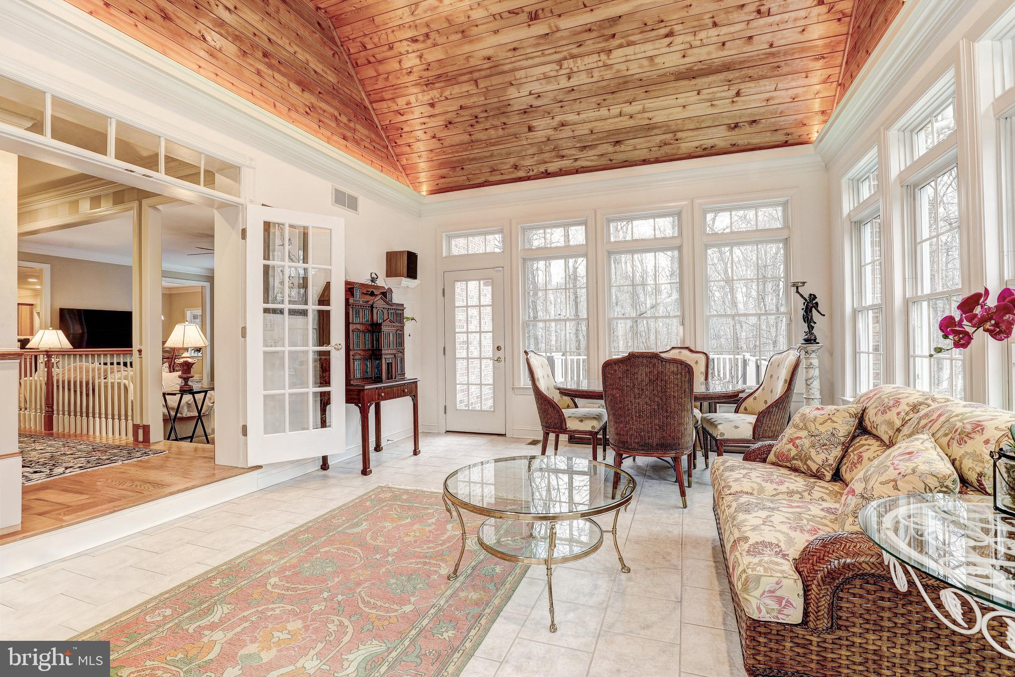 17420 Wesley Chapel Road Monkton, MD 21111 - Photo 10 of 76 a living room with furniture and a floor to ceiling window