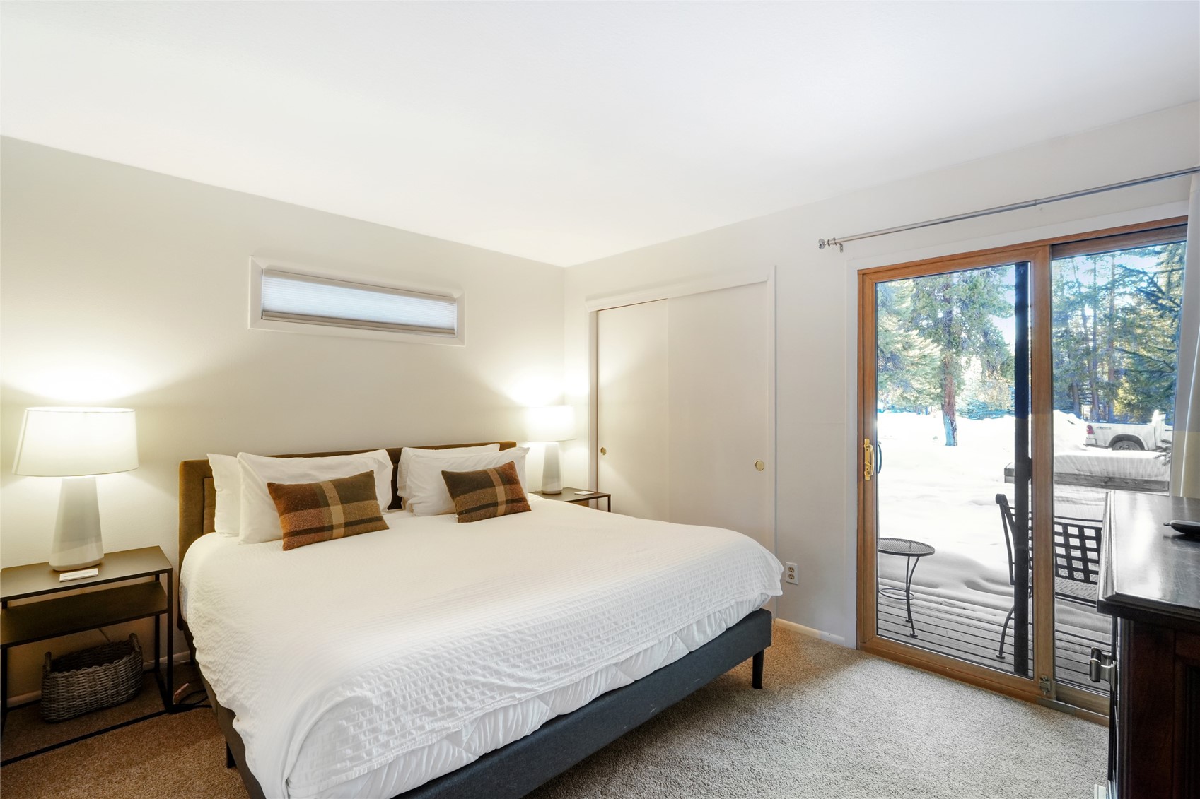 1937 Soda Ridge Road, Unit 1130 Dillon, CO 80435 - Photo 13 of 25 a bedroom with a bed and a night stand
