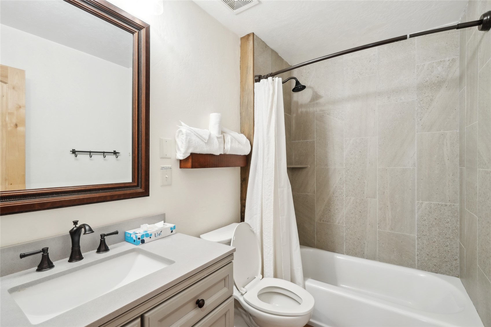 1937 Soda Ridge Road, Unit 1130 Dillon, CO 80435 - Photo 16 of 25 a bathroom with a sink a toilet and a bathtub