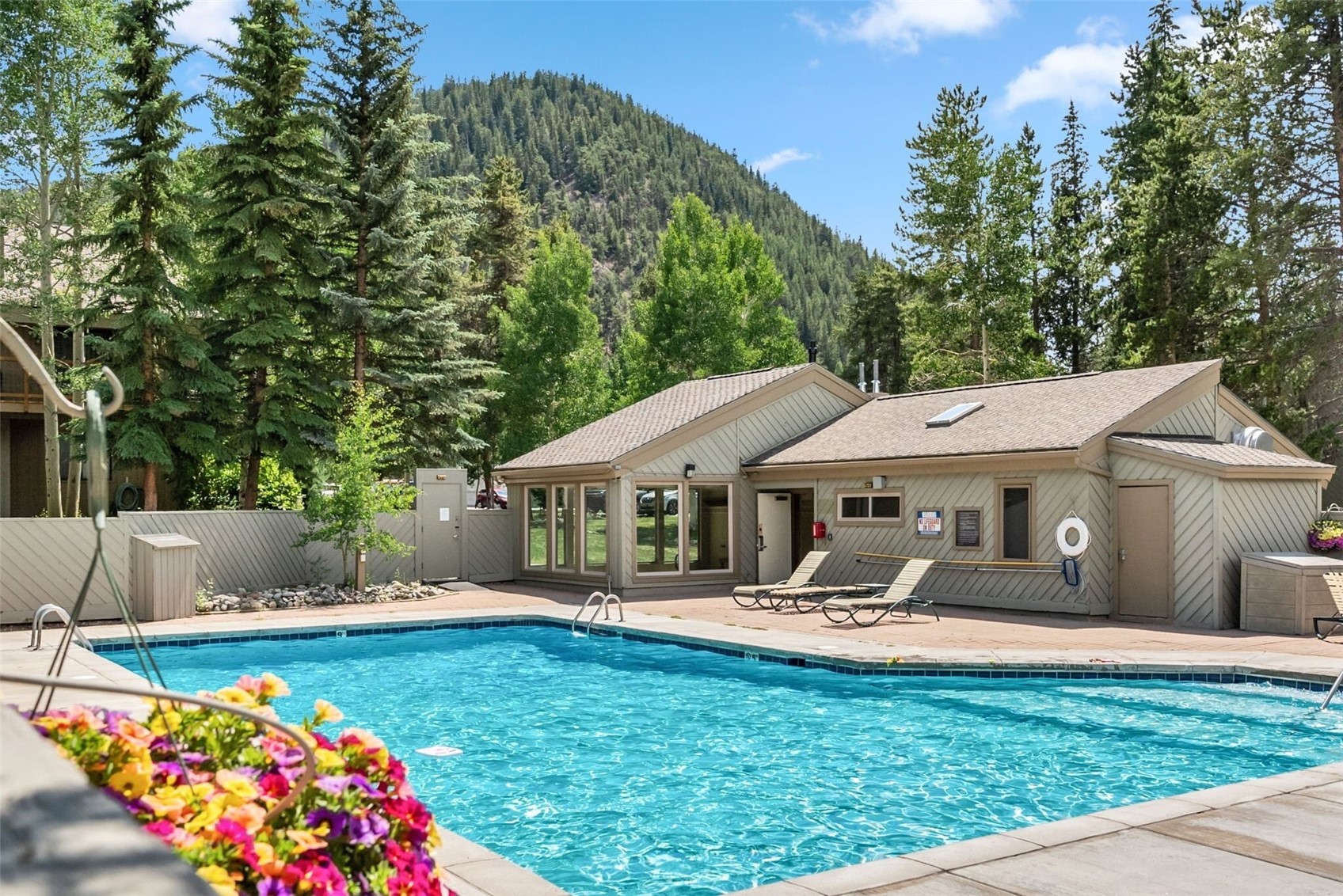 1937 Soda Ridge Road, Unit 1130 Dillon, CO 80435 - Photo 21 of 25 a front view of a house with garden and swimming pool