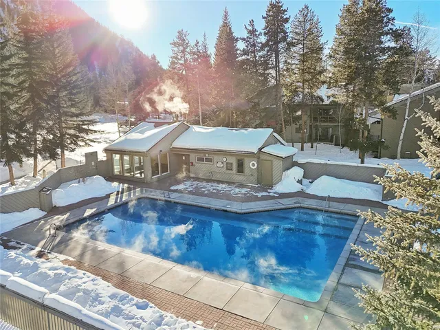 a view of house with outdoor space and swimming pool