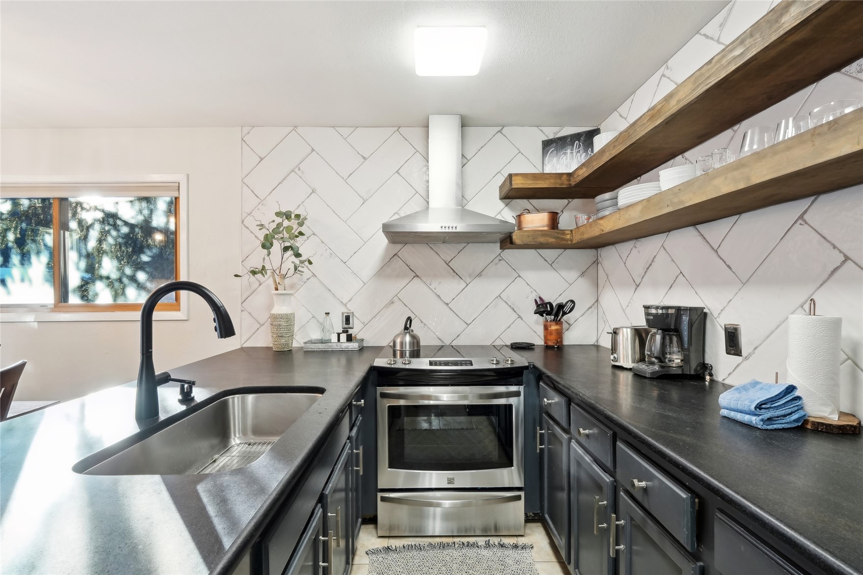 1937 Soda Ridge Road, Unit 1130 Dillon, CO 80435 - Photo 3 of 25 a kitchen with stainless steel appliances granite countertop a sink and a stove