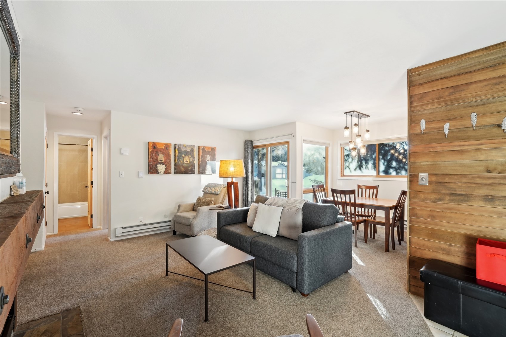 1937 Soda Ridge Road, Unit 1130 Dillon, CO 80435 - Photo 5 of 23 a living room with furniture and a wall painting
