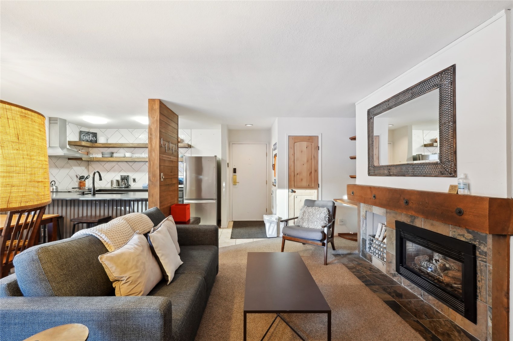 1937 Soda Ridge Road, Unit 1130 Dillon, CO 80435 - Photo 6 of 25 a living room with furniture and a fireplace