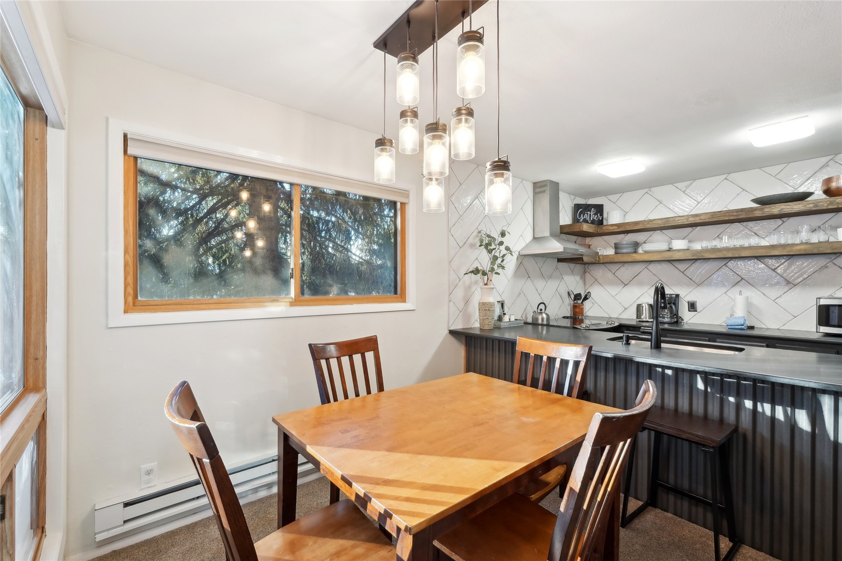 1937 Soda Ridge Road, Unit 1130 Dillon, CO 80435 - Photo 9 of 23 a view of a dining room with furniture window and wooden floor