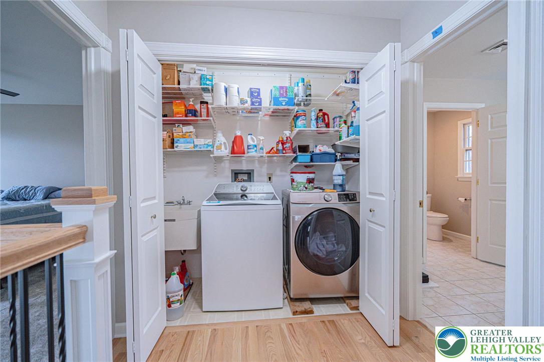 6551 Overlook Road Orefield, PA 18069 - Photo 34 of 82 a storage room with washer and dryer