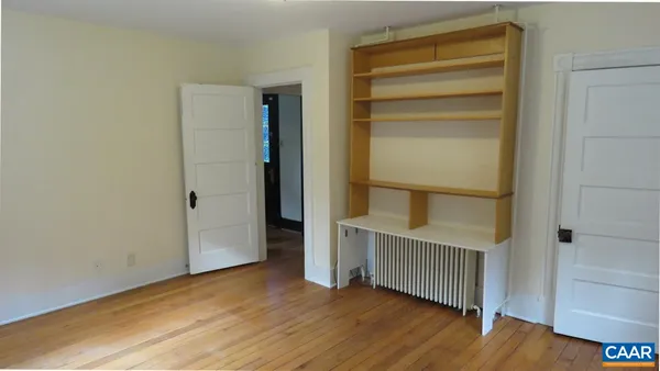 a view of entryway with wooden floor