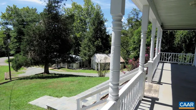 a view of a garden with deck
