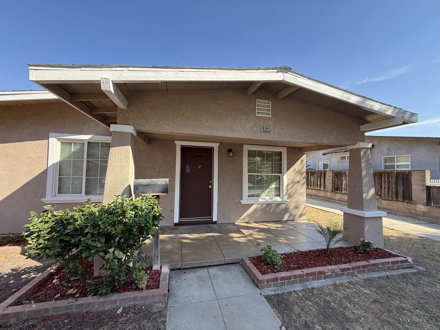 405 Colorado Avenue Modesto, CA 95351 - Photo 2 of 33 a front view of a house with garden