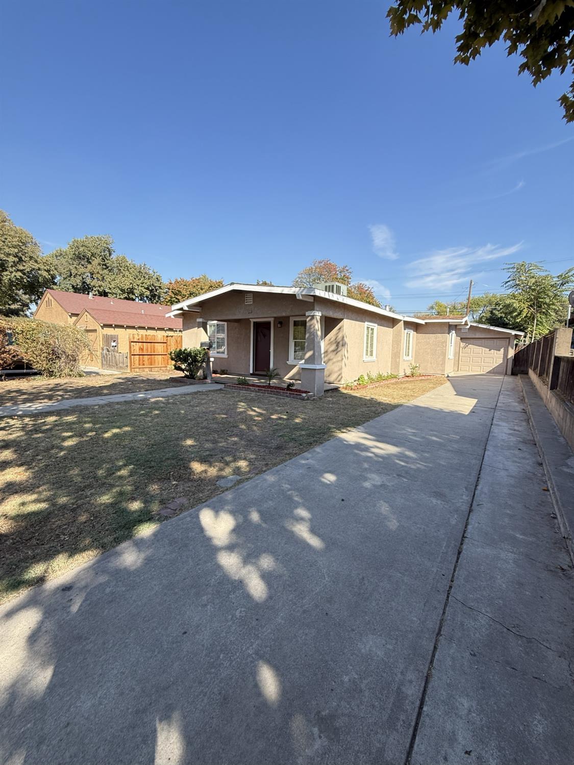 405 Colorado Avenue Modesto, CA 95351 - Photo 4 of 33 a view of a house with a yard