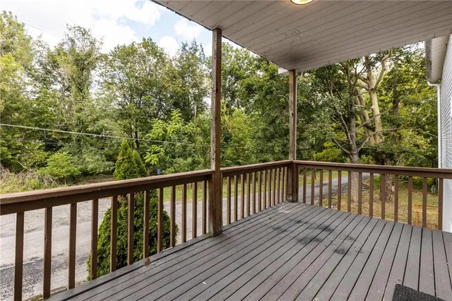 a view of balcony with wooden floor