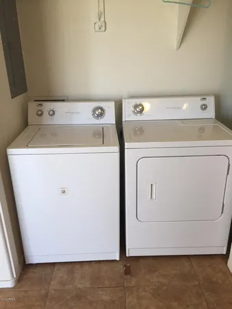 a utility room with dryer and washer