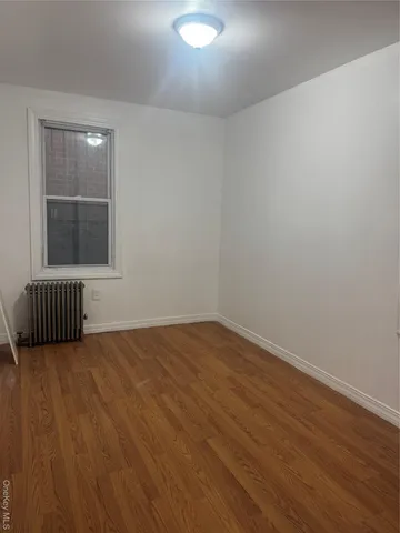 wooden floor and window in a room