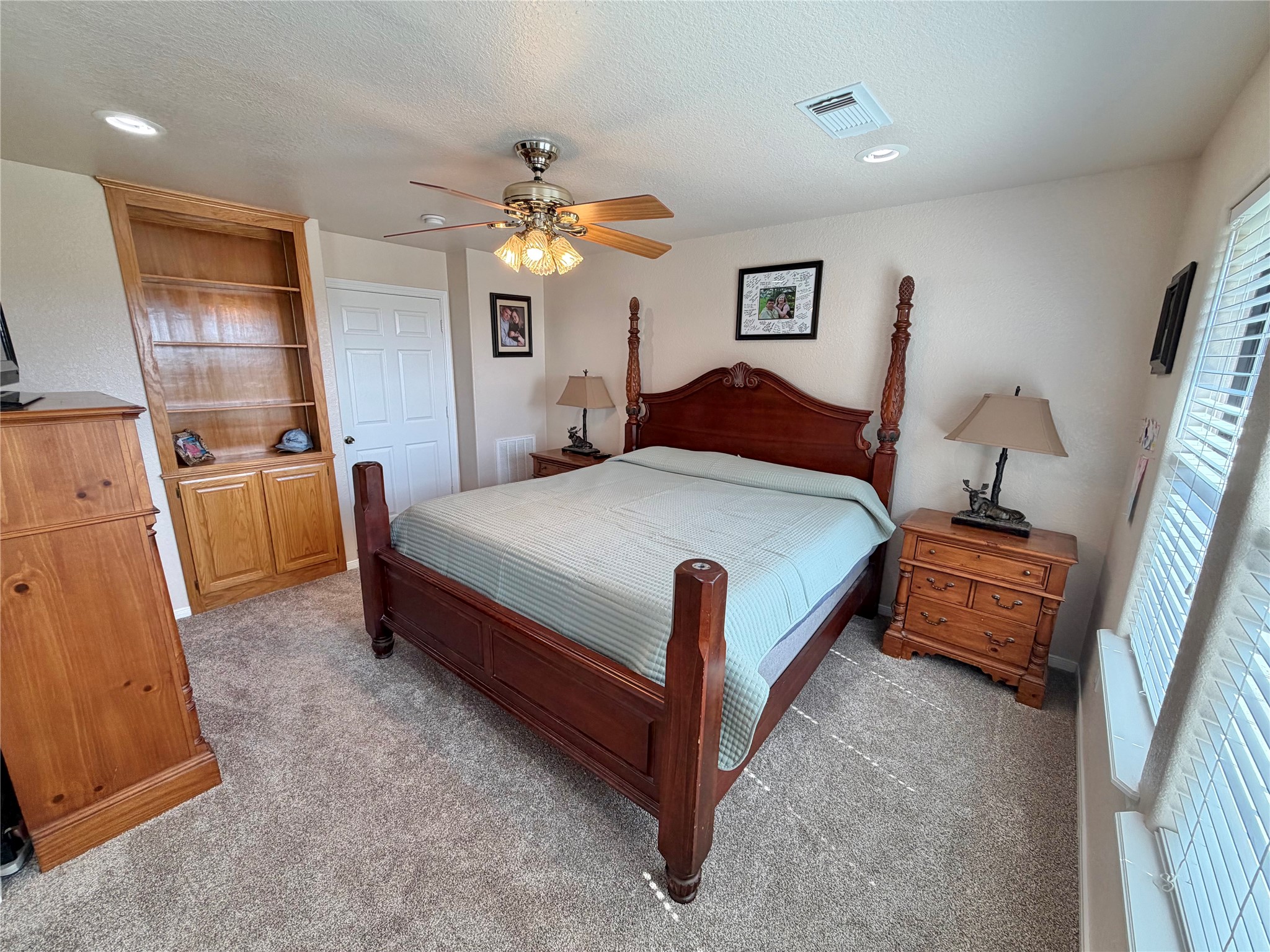 15903 County Road 621 Angleton, TX 77515 - Photo 18 of 33 a bedroom with a bed and a chandelier