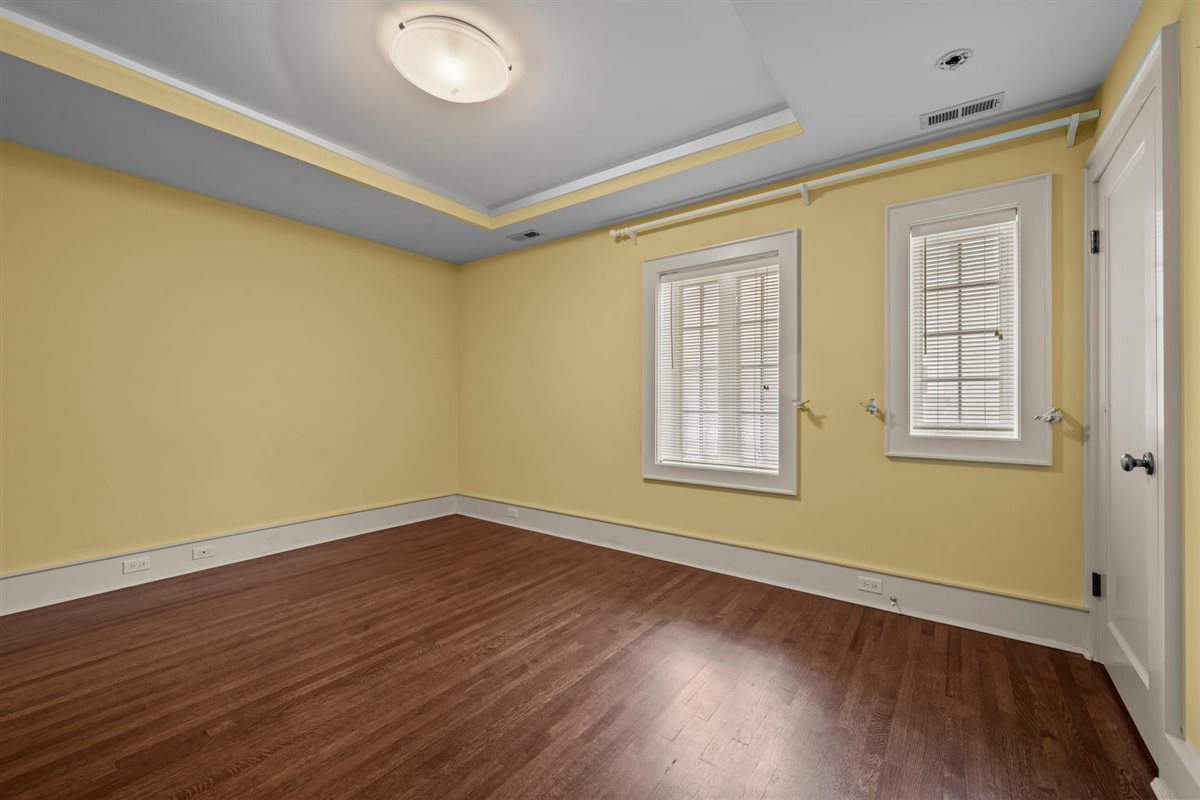 224 Sheridan Road Kenilworth, IL 60043 - Photo 45 of 62 a view of empty room with wooden floor and fan