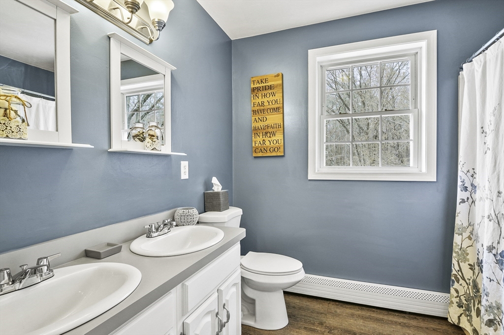 173 Oakham Road North Brookfield, MA 01535 - Photo 24 of 30 a bathroom with a granite countertop sink and a mirror