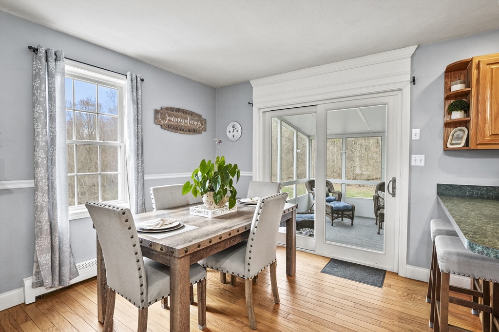 173 Oakham Road North Brookfield, MA 01535 - Photo 7 of 30 a dining room with furniture and wooden floor