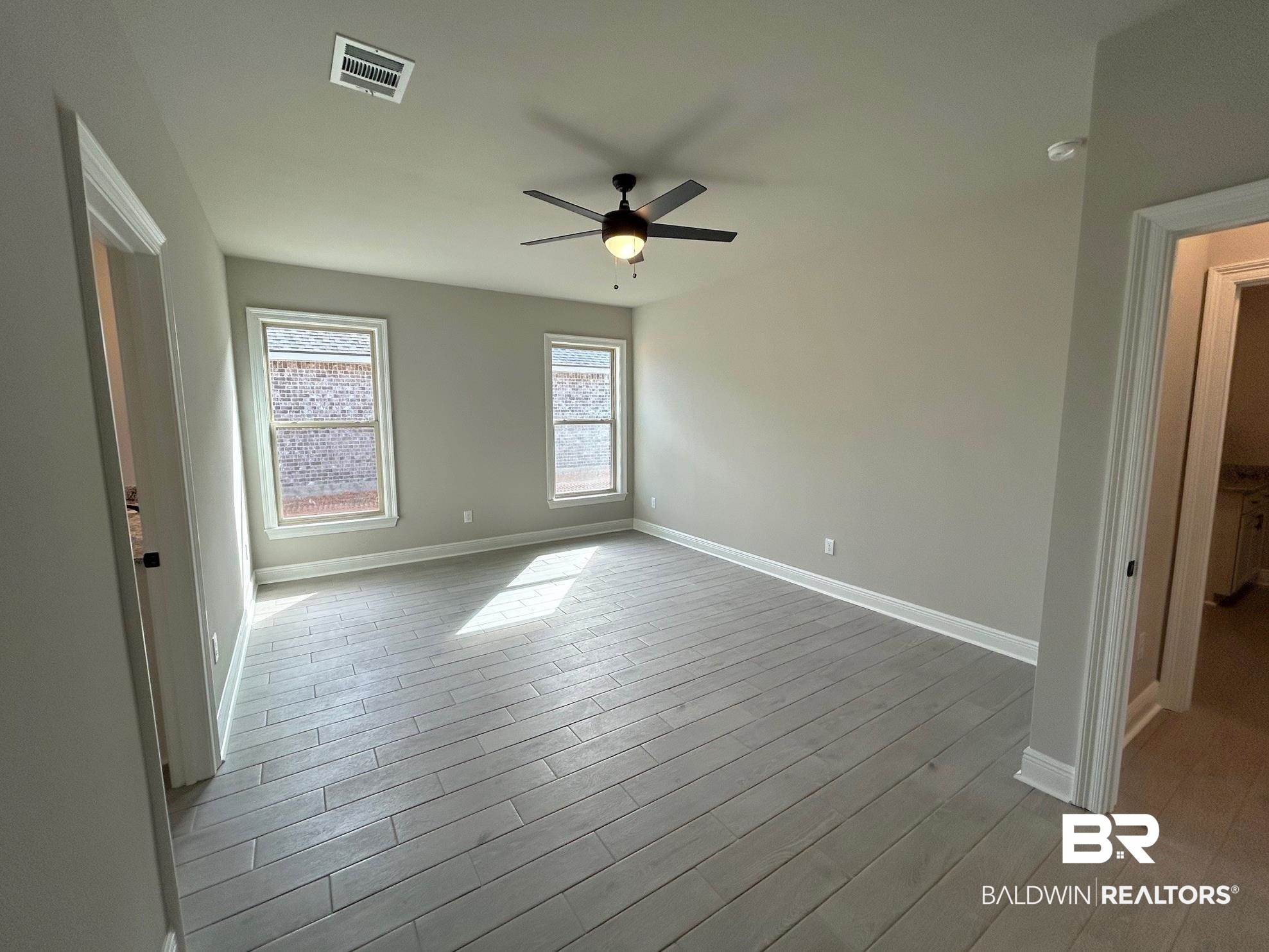 881 Sumter Loop Foley, AL 36535 - Photo 6 of 19 Spare room featuring ceiling fan and light wood-type flooring