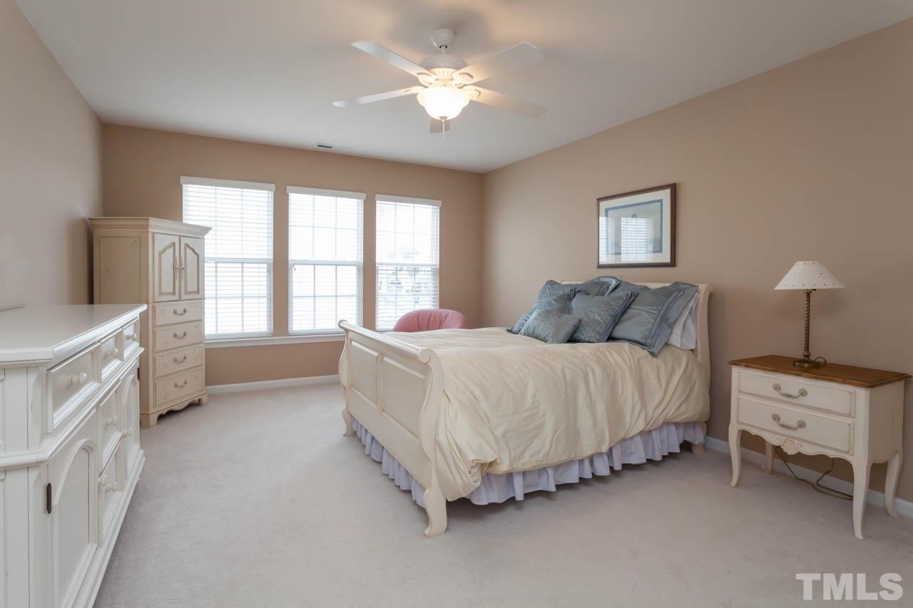 7472 Silver View Lane Raleigh, NC 27613 - Photo 18 of 25 a bedroom with a bed and a window