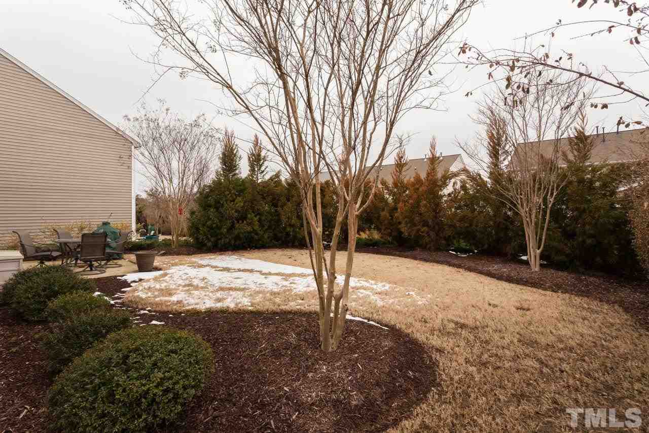 7472 Silver View Lane Raleigh, NC 27613 - Photo 20 of 25 a view of a yard covered in snow