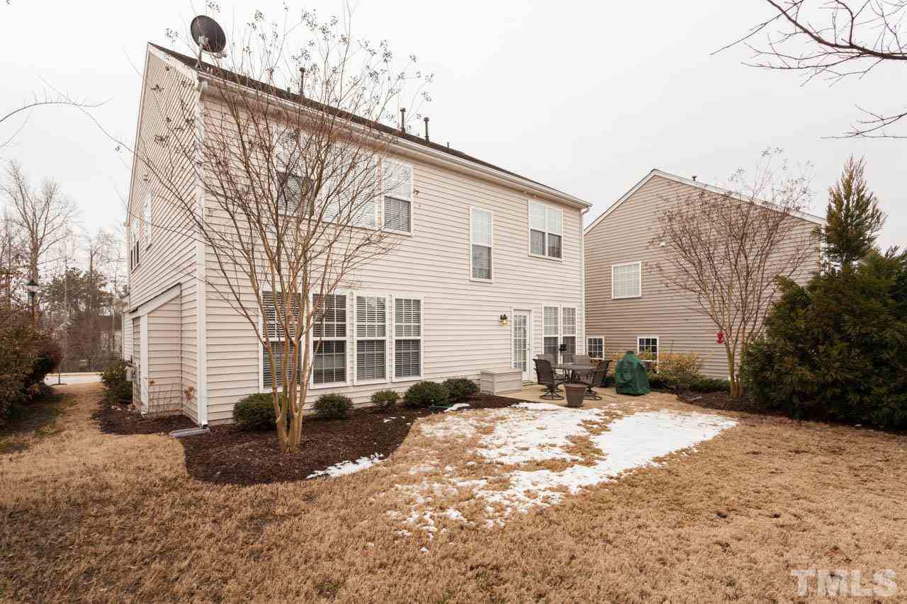 7472 Silver View Lane Raleigh, NC 27613 - Photo 21 of 25 a backyard of a house with fire pit and couches