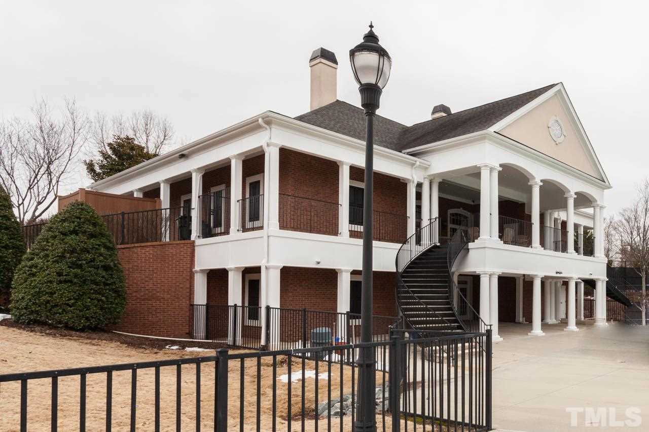 7472 Silver View Lane Raleigh, NC 27613 - Photo 23 of 25 a front view of a house with a yard