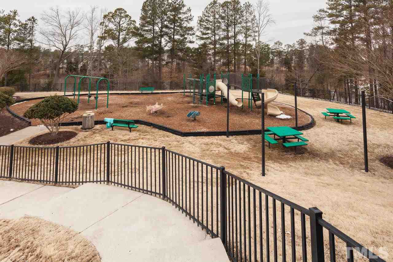 7472 Silver View Lane Raleigh, NC 27613 - Photo 24 of 25 a view of a street with large trees
