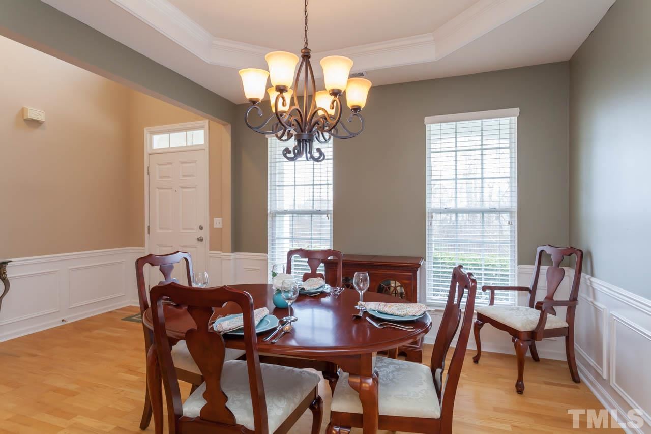 7472 Silver View Lane Raleigh, NC 27613 - Photo 8 of 25 a view of a dining room with furniture window and outside view