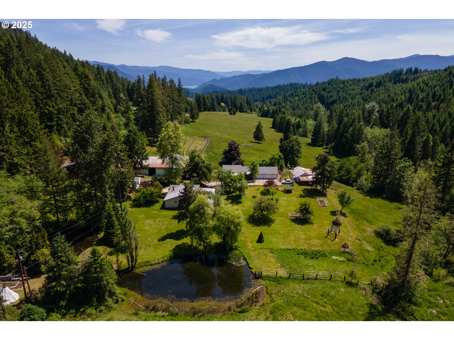 77690 Brock Road Oakridge, OR 97463 - Photo 2 of 45 a view of a house with a garden