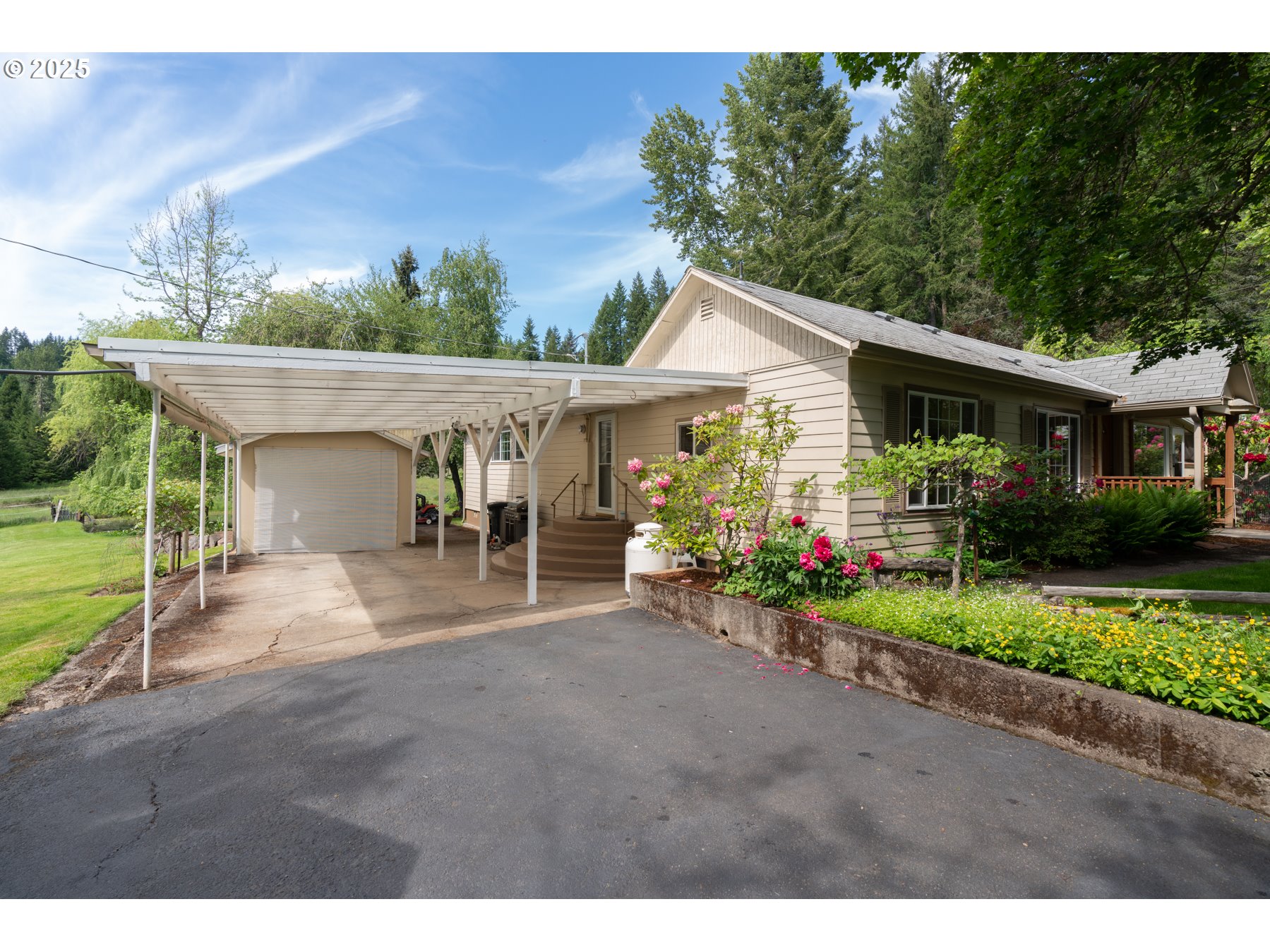 77690 Brock Road Oakridge, OR 97463 - Photo 32 of 45 a view of a house with porch and garden