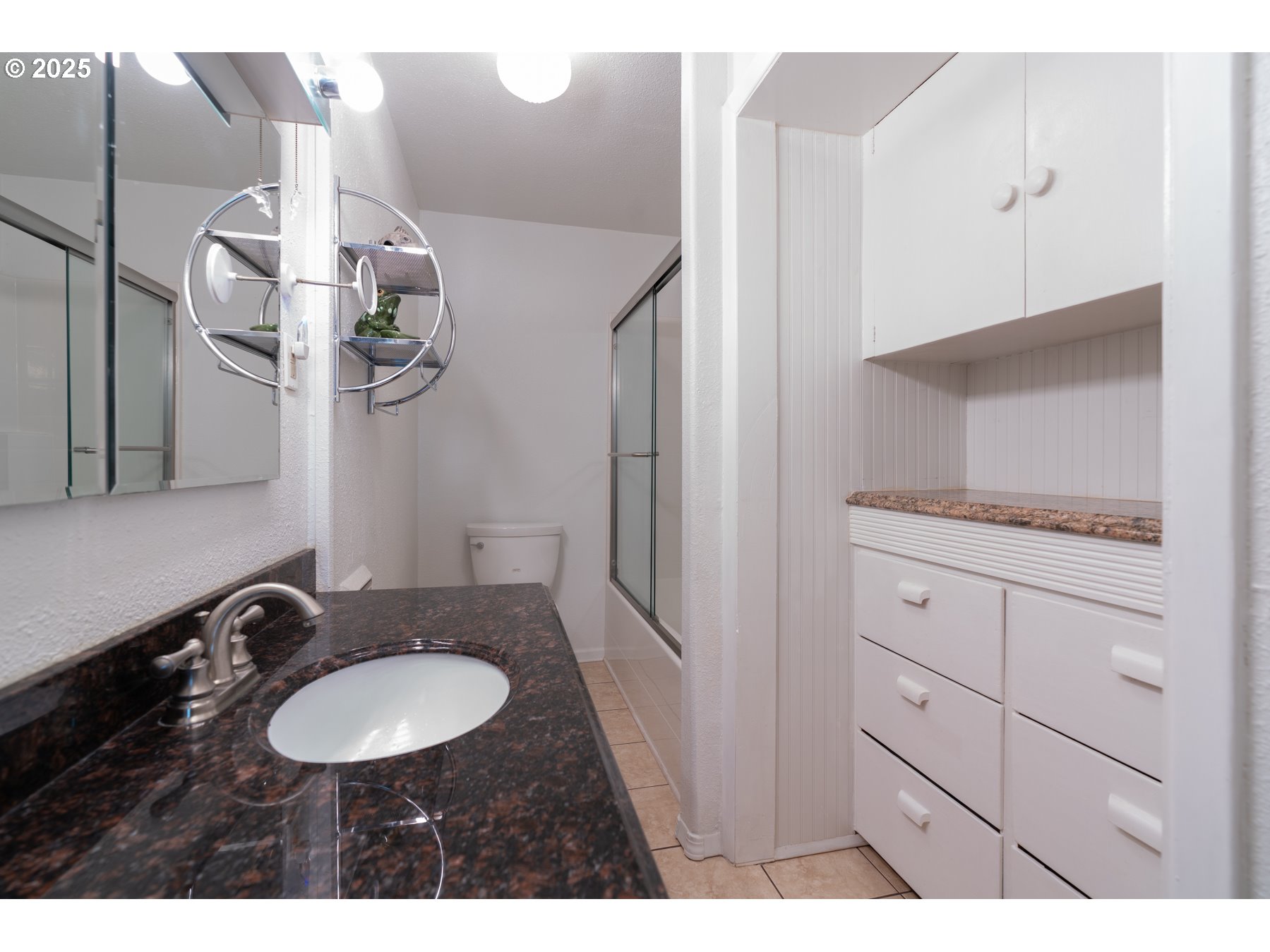 77690 Brock Road Oakridge, OR 97463 - Photo 41 of 45 a bathroom with a granite countertop sink and a mirror