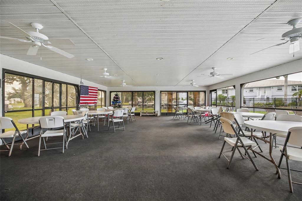 26485 Rampart Boulevard, Unit A27 Punta Gorda, FL 33983 - Photo 27 of 27 a outdoor space with lots of table and chairs