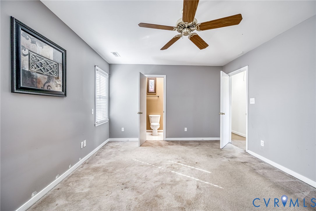 9301 Brocket Drive Midlothian, VA 23112 - Photo 20 of 27 an empty room with fan and windows