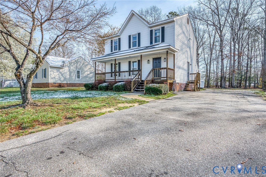 9301 Brocket Drive Midlothian, VA 23112 - Photo 2 of 27 a view of an house with backyard and trees
