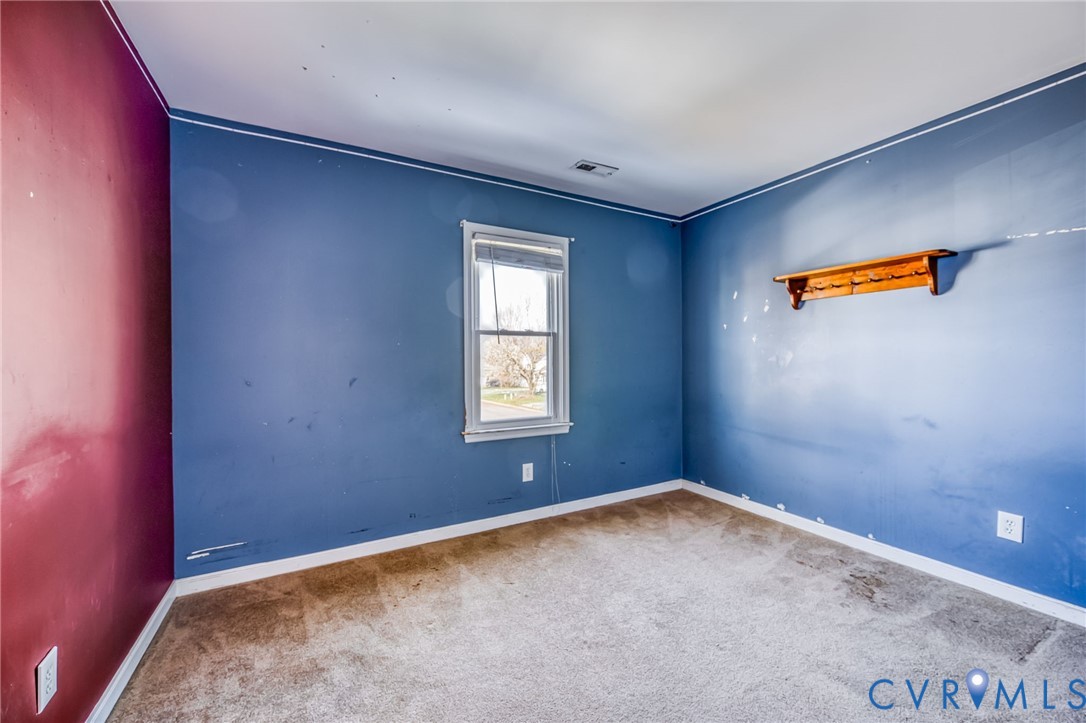 9301 Brocket Drive Midlothian, VA 23112 - Photo 22 of 27 an empty room with an empty space and a window